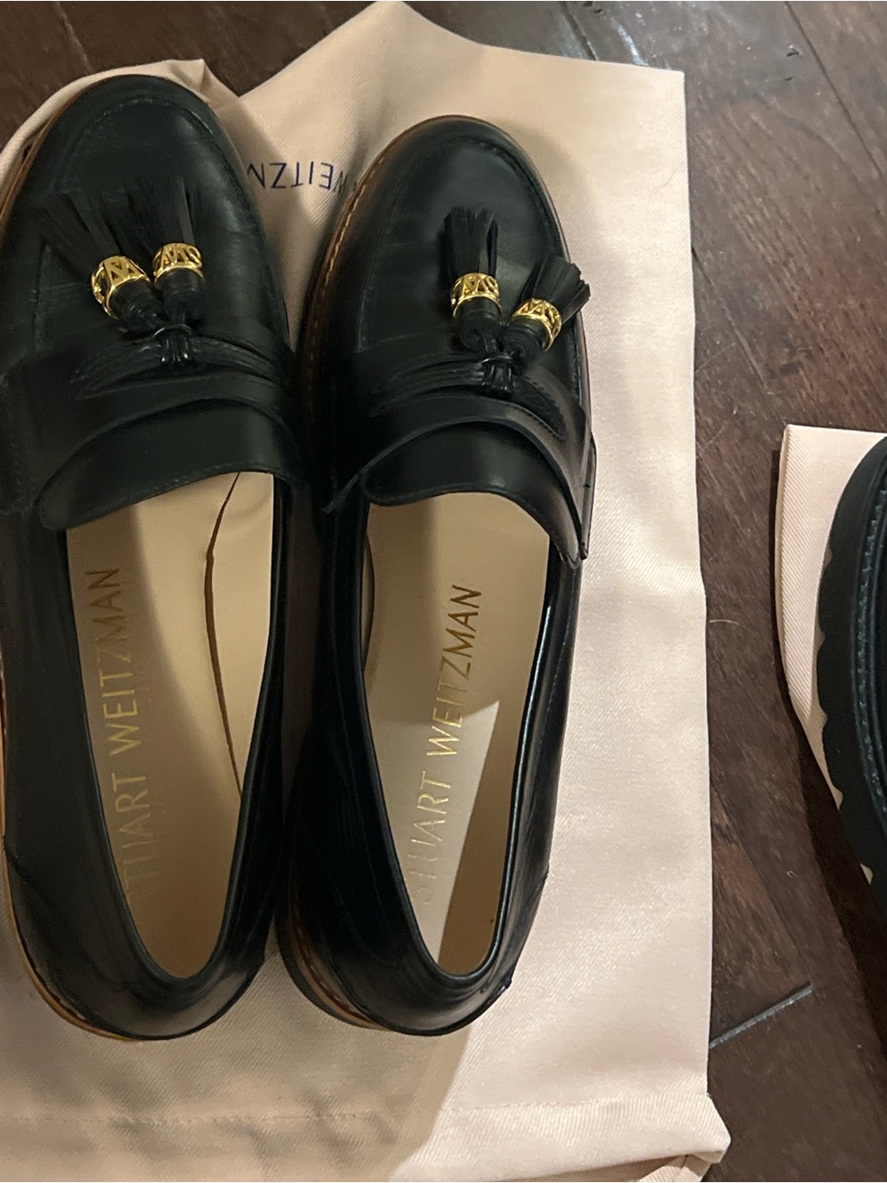Stuart Weitzman Black Leather Tassel Loafers with Gold Hardware